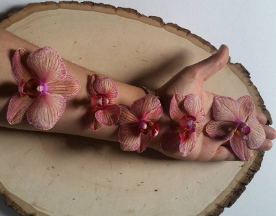 Orchids on arm.png