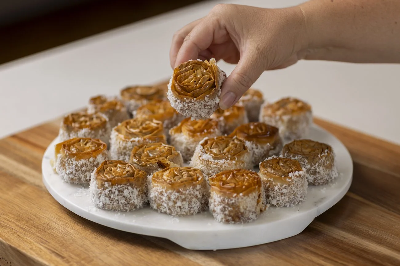 coconut and almond baklava in a rose shape with a vanilla bean syrup