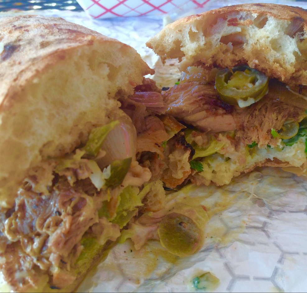 "Plump Sammy stuffed with pork, onions, and jalapeños. Damn good!"