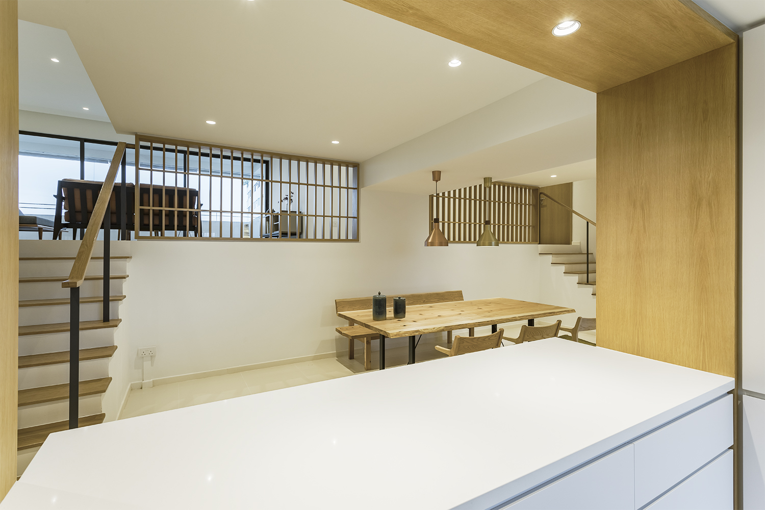 Kitchen counter provides visual continuity to dining room at Pandan Valley Condominium 
