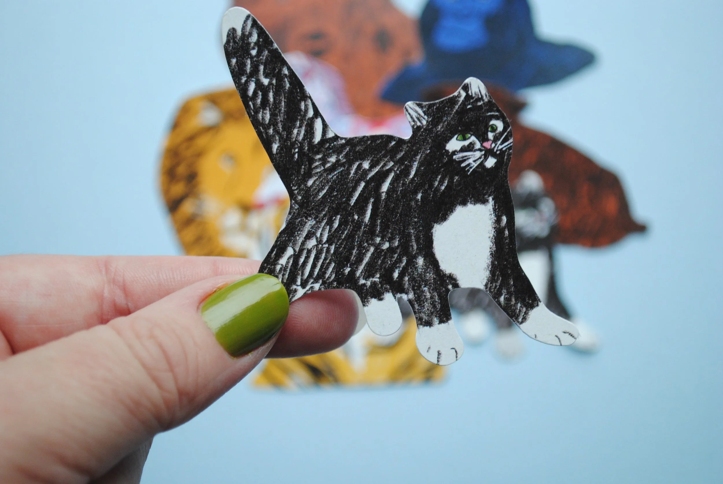 Black_and_white_cat_sticker_hand.jpg