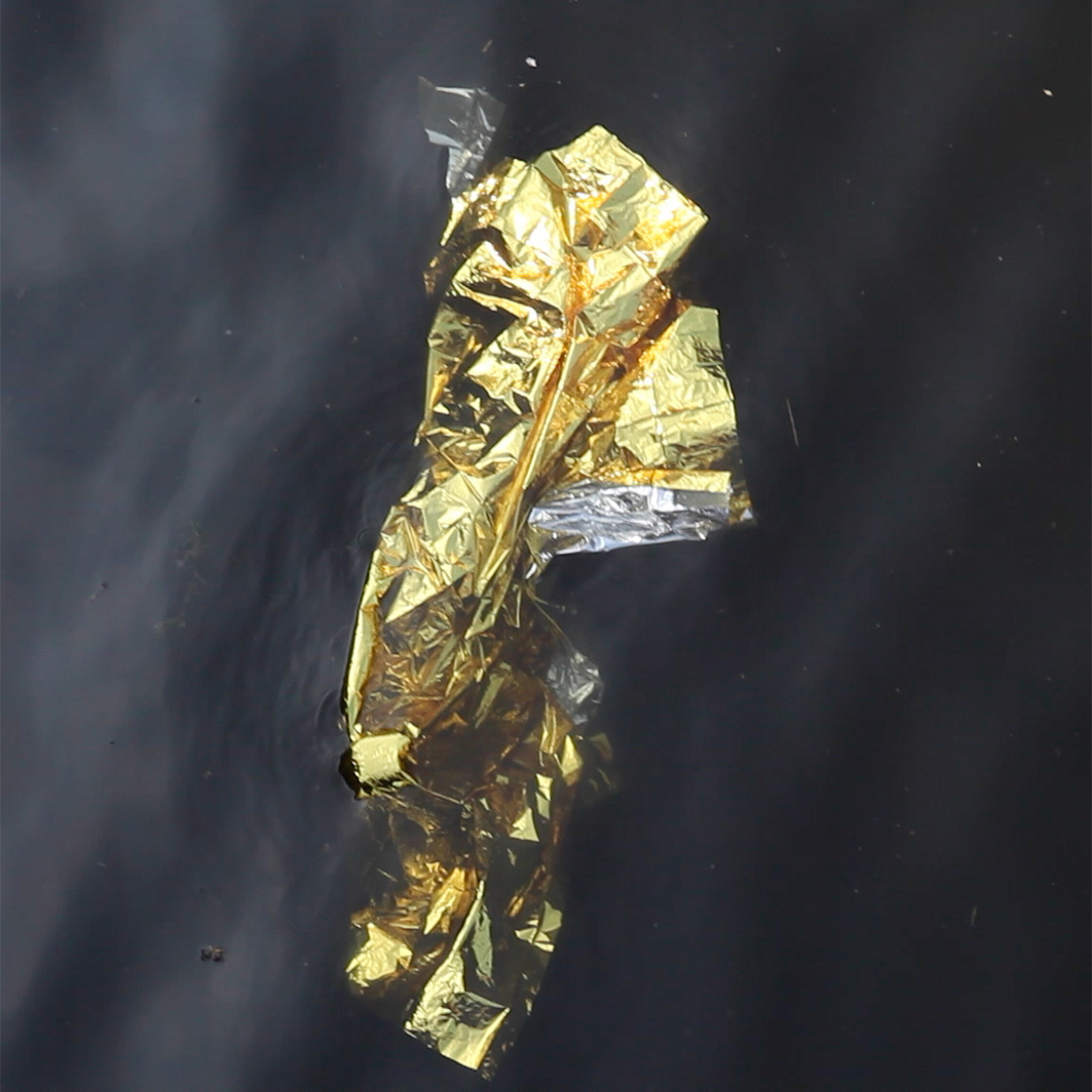 Blanket (2017) digital video still, mylar survival blanket and River Lea