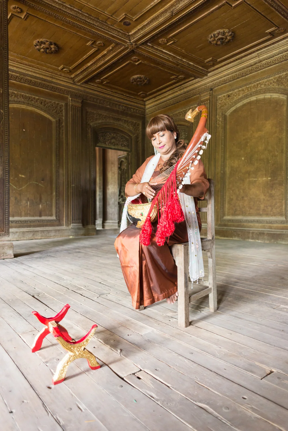 Harpist greets monastery guests