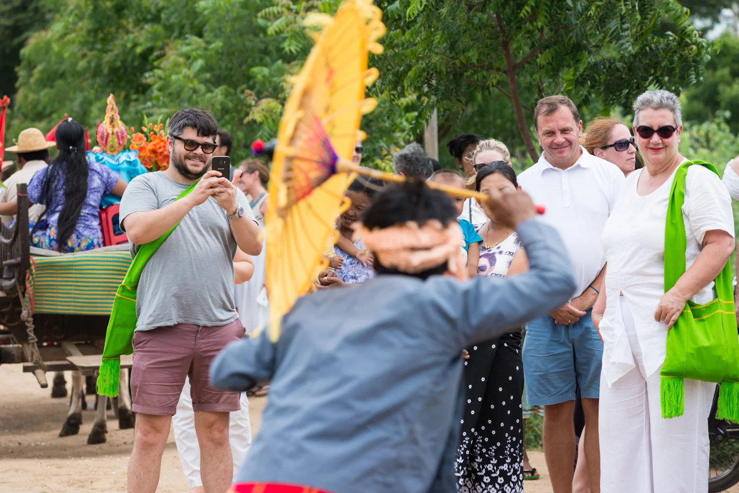 Photographing an initiation procession dancer