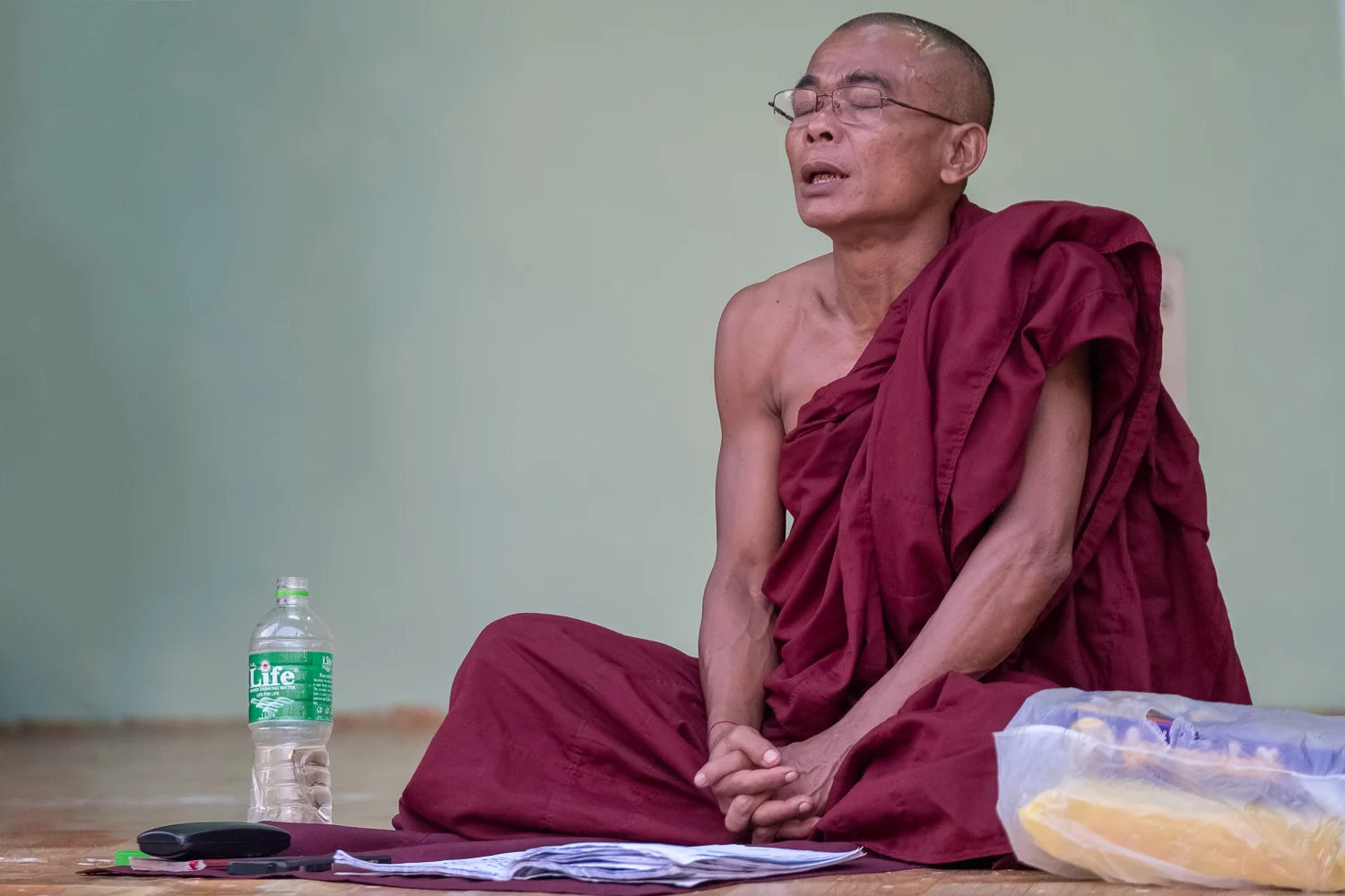 Monk praying at Shwedagon pagoda