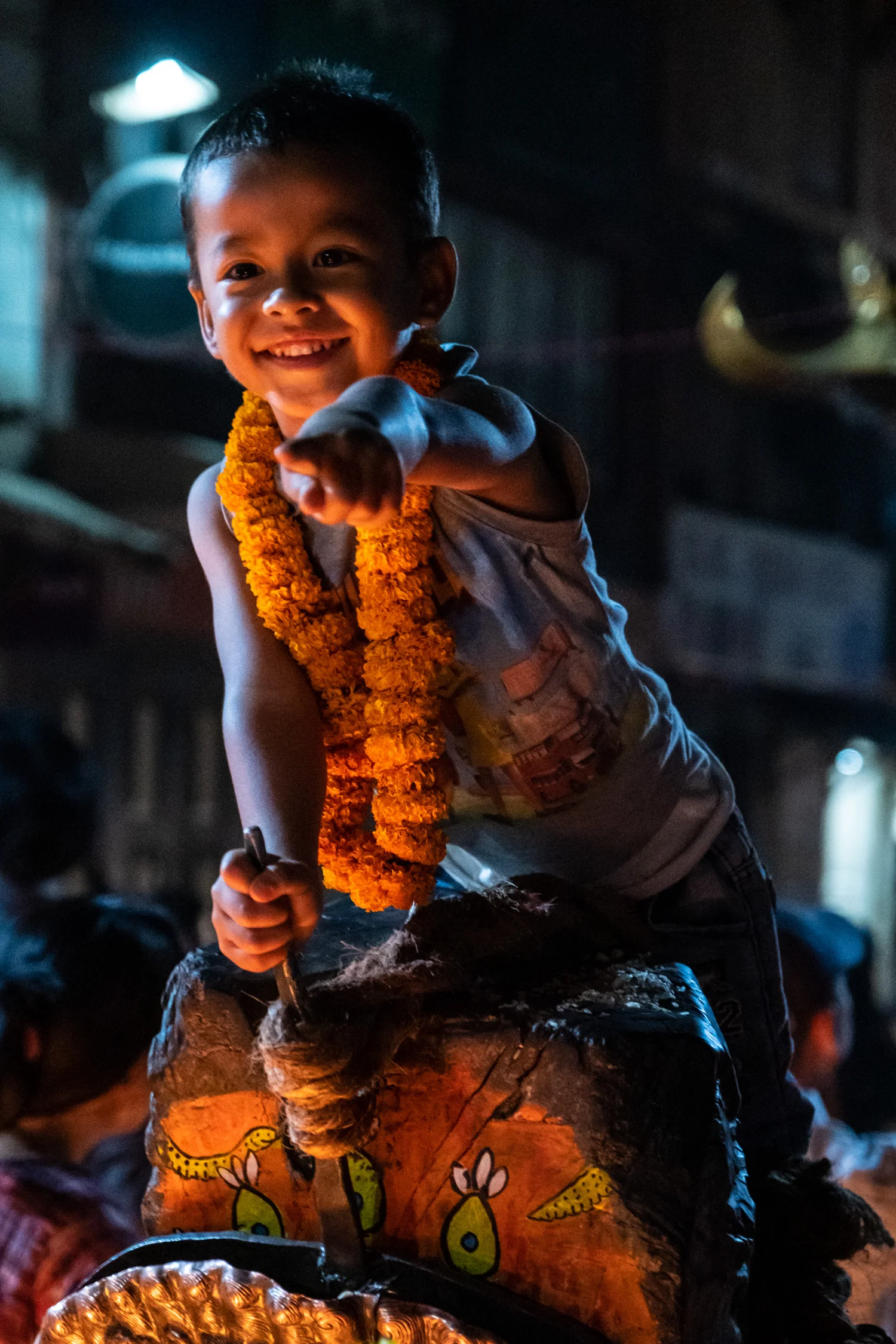 Nepalese child playing under Rato Machhendranath