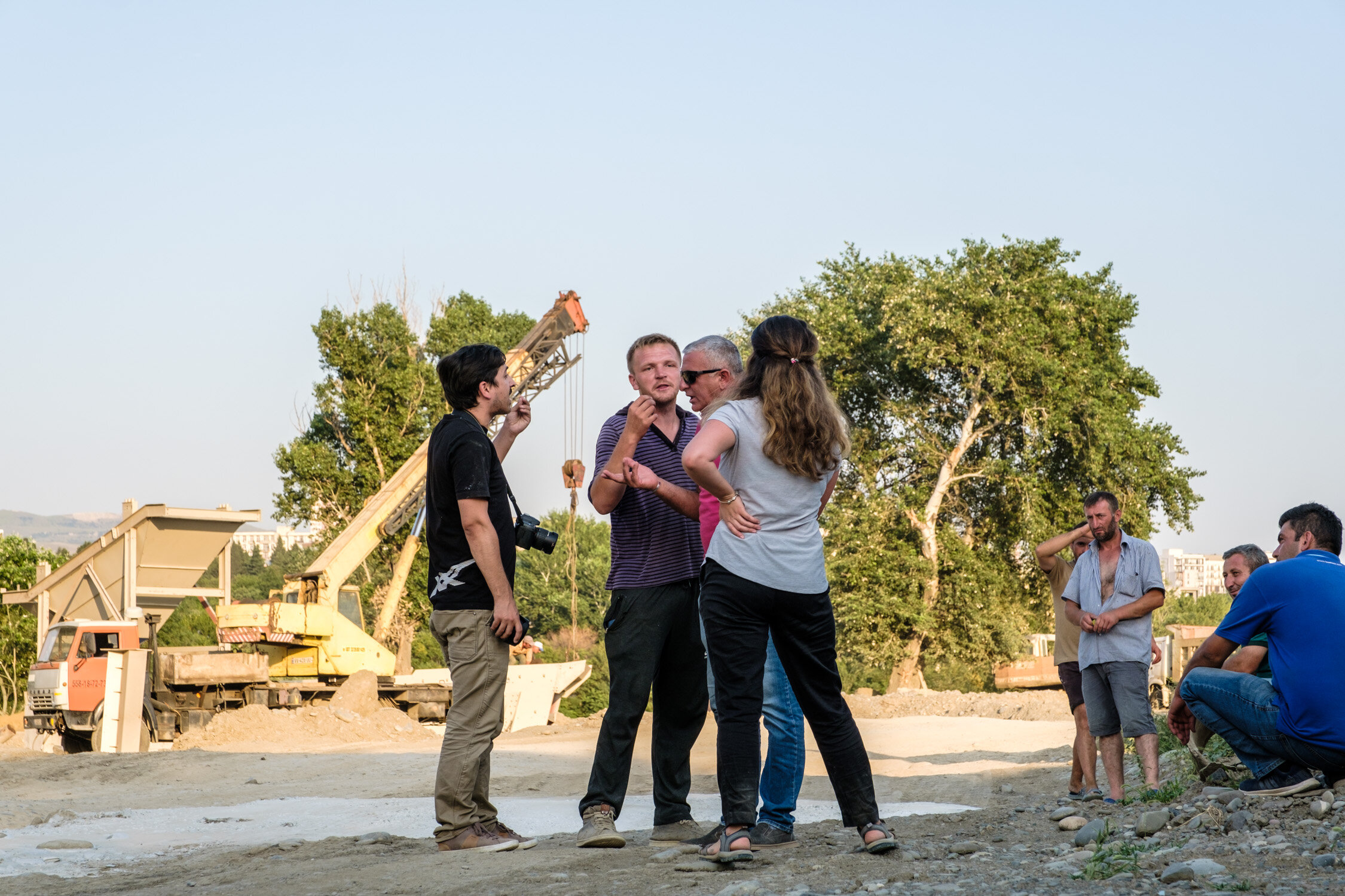 Processing site workers argue with the activists