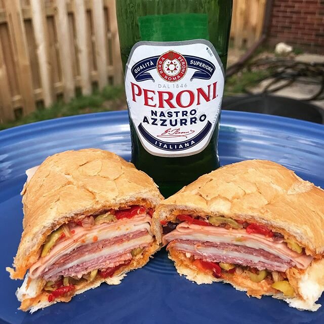 We couldn&rsquo;t go to NOLA, so we brought NOLA to us. Muffuletta w. Spicy Sweet Heat Tapenade and Peroni Beer. Preorder Hot Sauce (Ships this month) at www.mittenmadepicklingco.com/shop-1 #michigan #hotsauce #nola #muffuletta #peroni #supportsmallb
