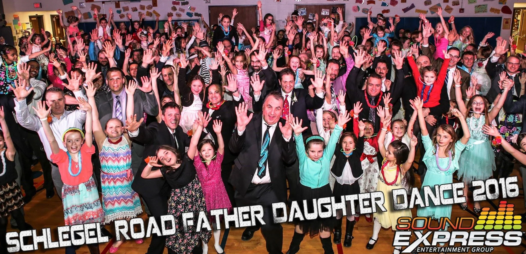 A crowded dance floor at the Schlegel Road Elementary Father Daughter Dance in Webster, NY, featuring professional DJ entertainment and interactive lighting by Sound Express Entertainment