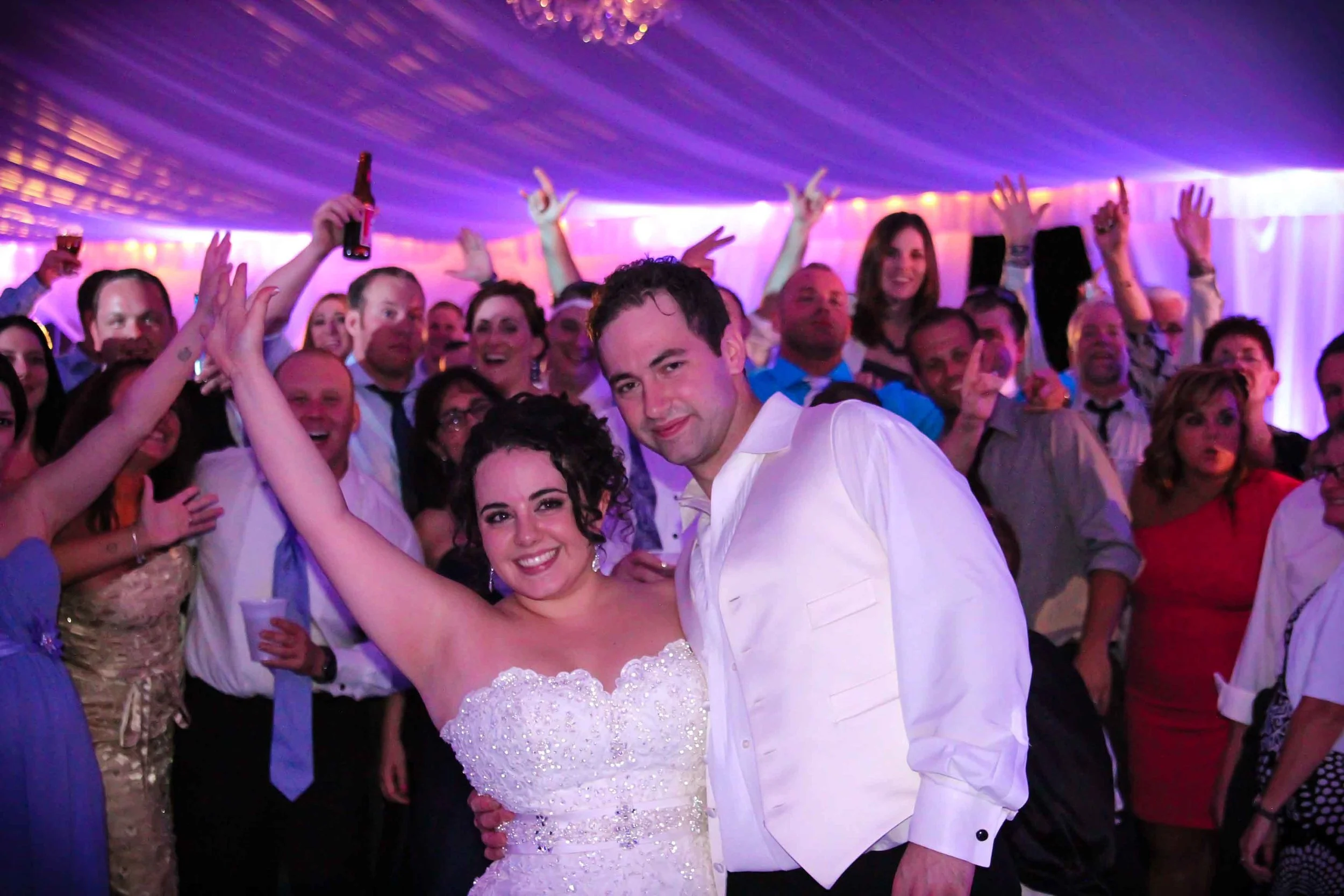 Bride and Groom on the Dance Floor with Guests