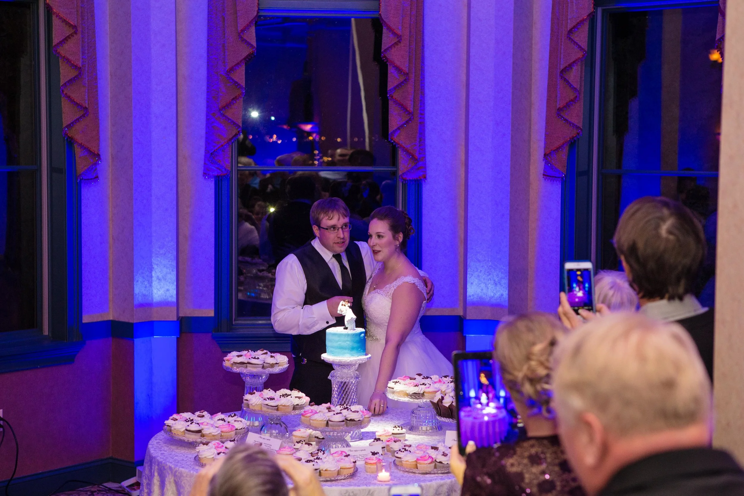 Bride & Groom Cutting Cake