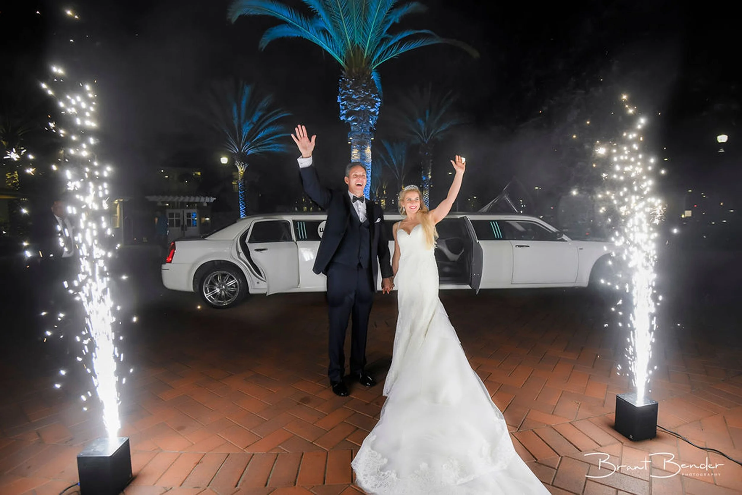 Newlyweds celebrating outside with cold sparkler towers at a Finger Lakes or Western New York wedding served by Sound Express Entertainment