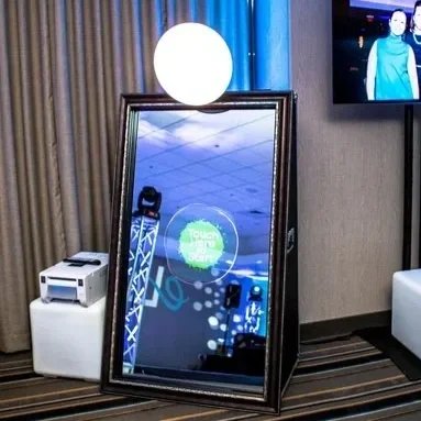 Sound Express Entertainment mirror photo booth setup at a Rochester NY wedding with digital display and open air printer