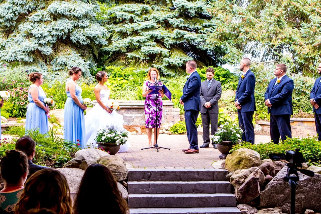 Bride and groom celebrating with wedding party outside after ceremony with professional sound provided by Sound Express Entertainment in Rochester NY