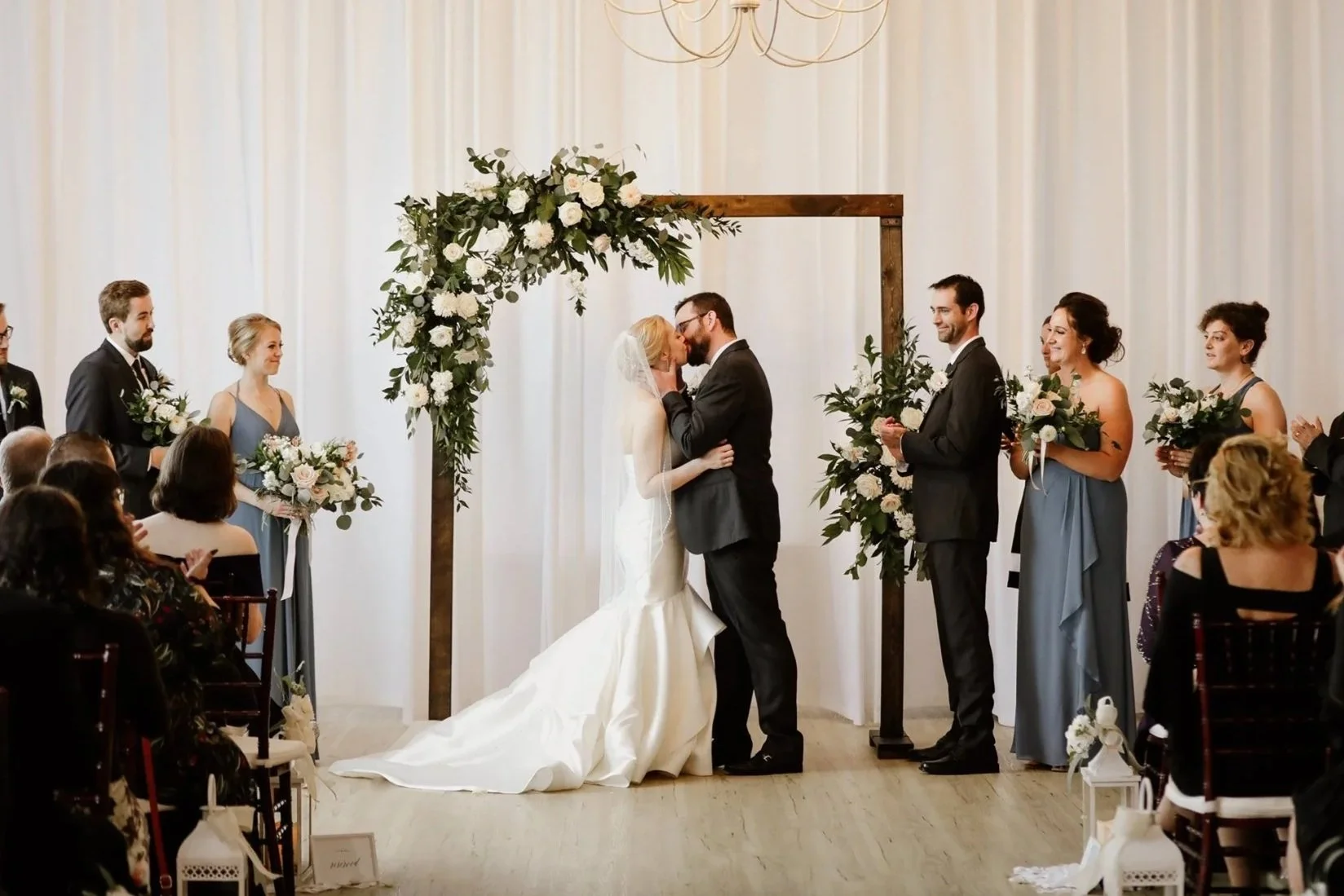 Discreet wireless lapel microphone and high-fidelity sound system setup for an outdoor wedding ceremony.