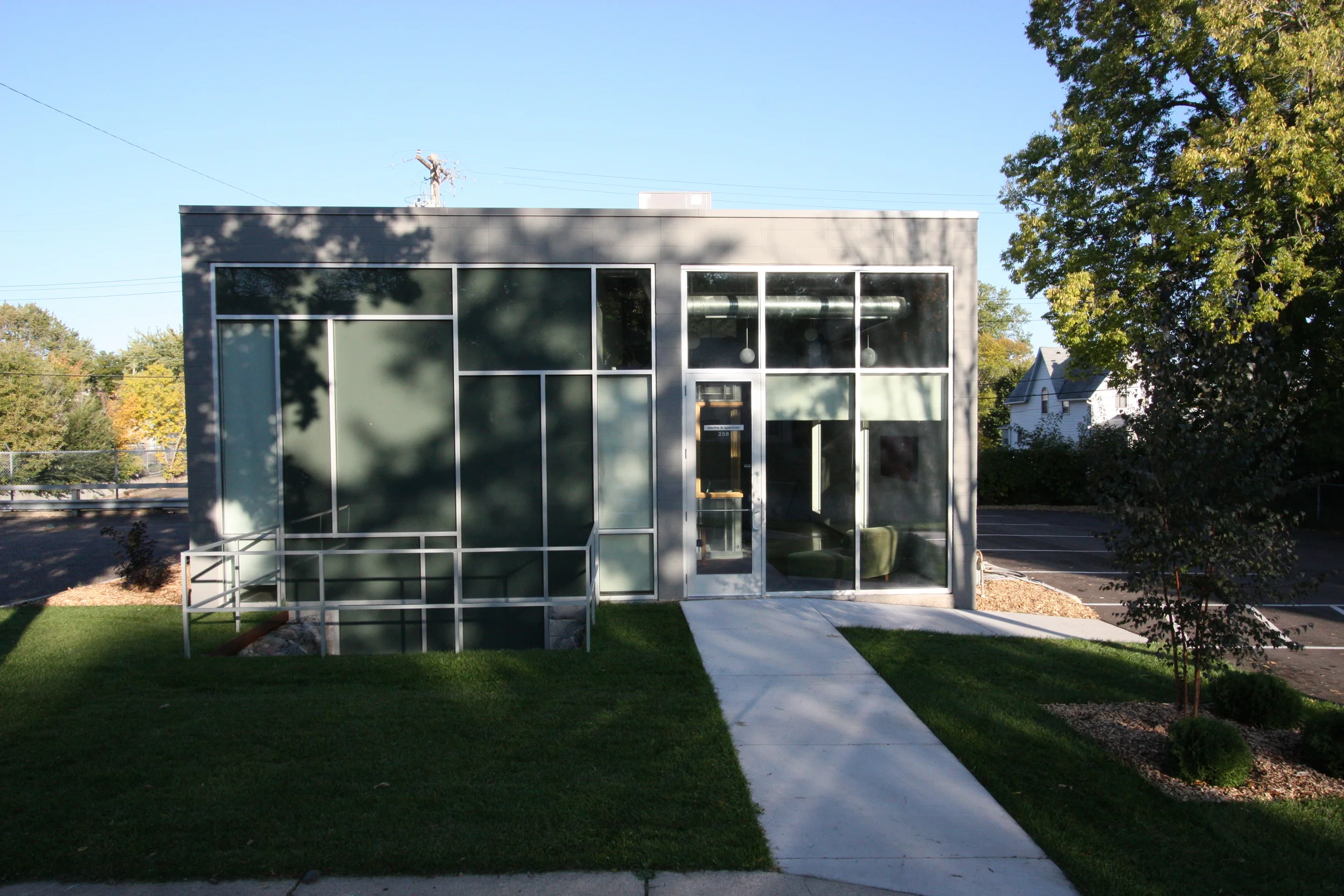  Exterior entry approach. &nbsp;  We added 10 courses of block to the existing 50's single level building to create higher ceilings and allow for the isolated poured concrete isolated slab in the live room.  with m.a Architecture 