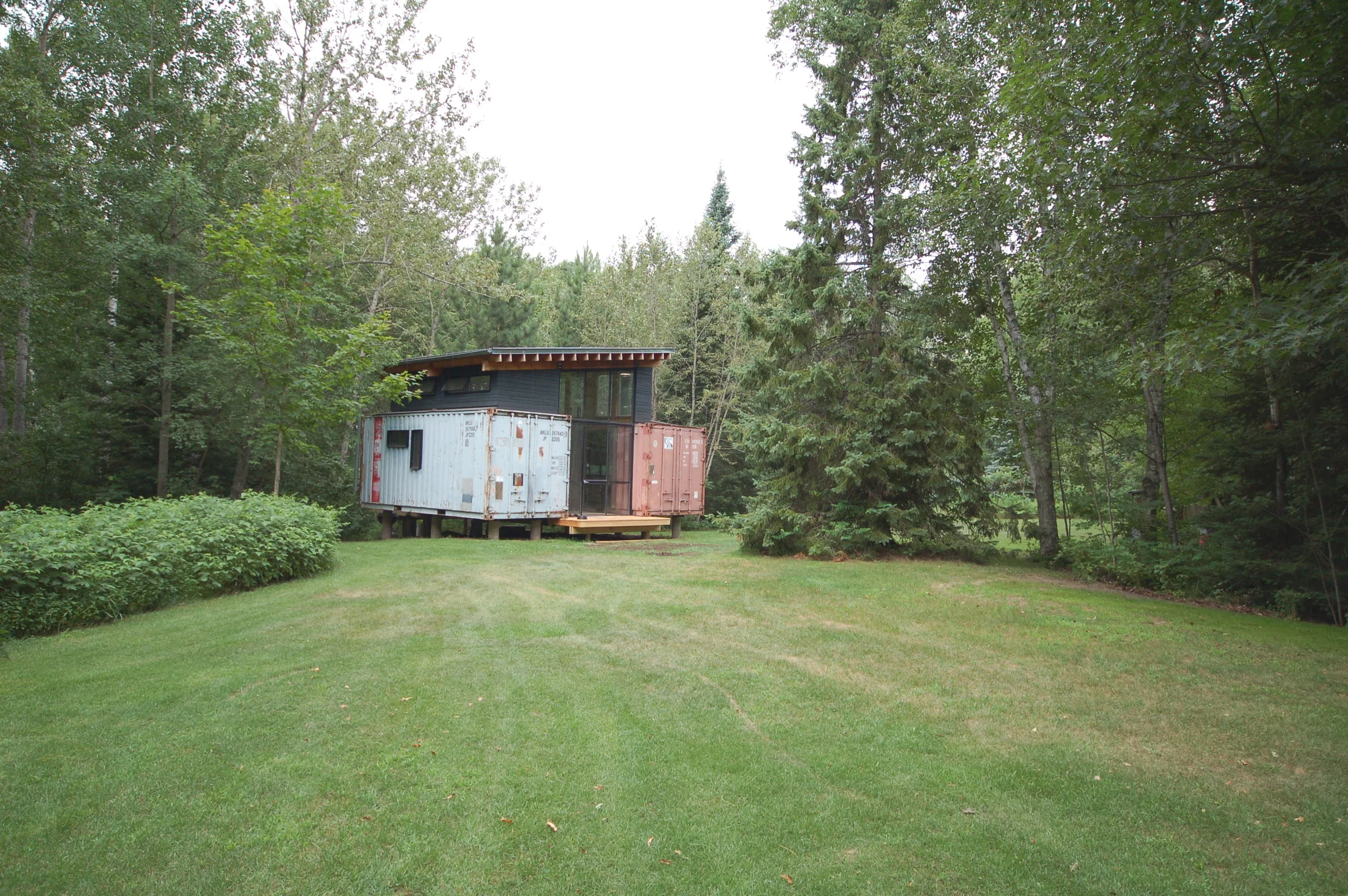  Container cabin in northern Minnesota. &nbsp;Built and designed by Paul Stankey, friends and family for a family retreat. &nbsp;Two shipping recycled shipping containers with a glass space in between. &nbsp;All steel windows were fabricated by Innat