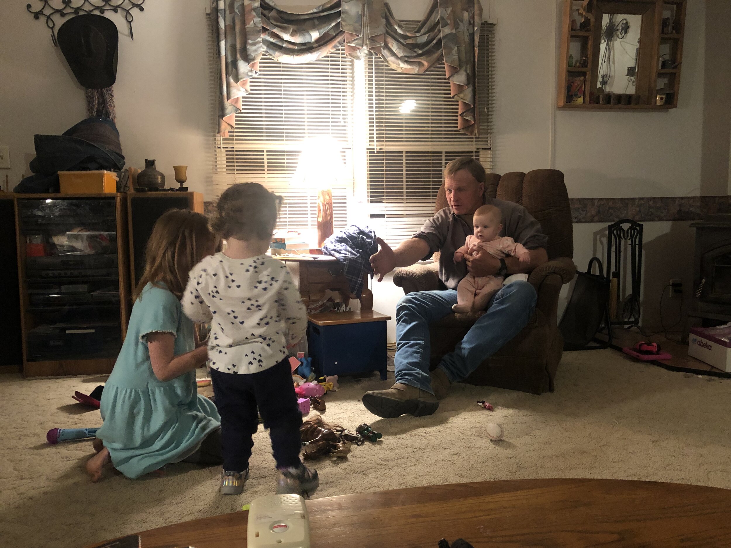 Dad, surrounded by his gals on his birthday.