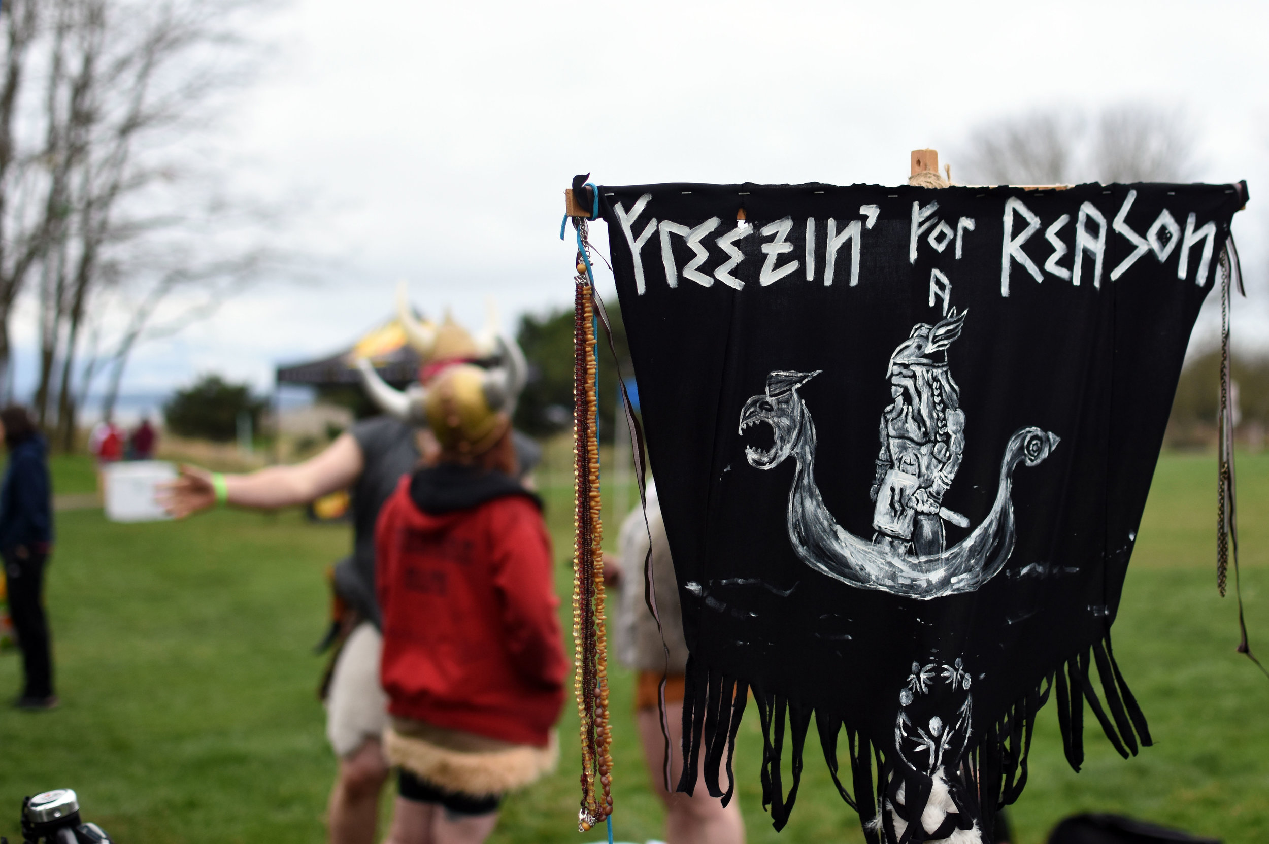  The Nearly Nekkid Vikings fly a banner with their motto "Freezin' for a Reason" near their tent at Golden Gardens Park on Feb. 6, 2016. 