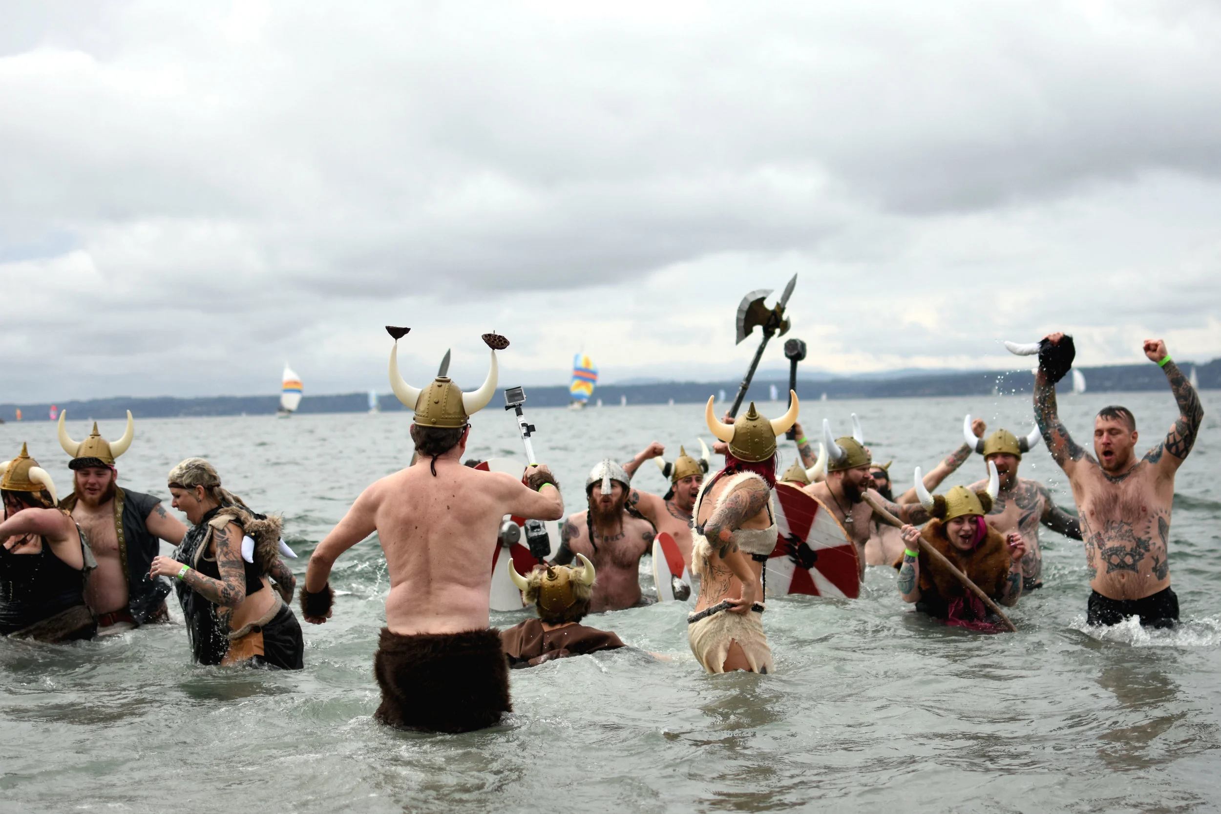  Members of the Nearly Nekkid Vikings celebrate in the bitter cold water following a walking, running and jumping into the Puget Sound for a Special Olympics fundraiser on Feb. 6, 2016.  