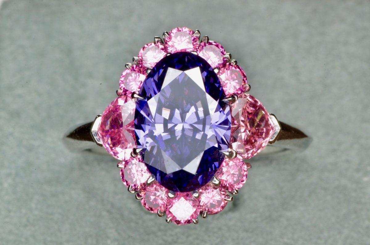 The Argyle Violet Diamond set in a beautiful platinum diamond setting surrounded by 12 rare vivid pink diamonds. On display at the Natural History Museum of Los Angeles