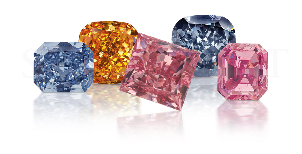 A collection of blue, orange, and pink diamonds from L.J. West Diamonds. (0.30 carats in size each)