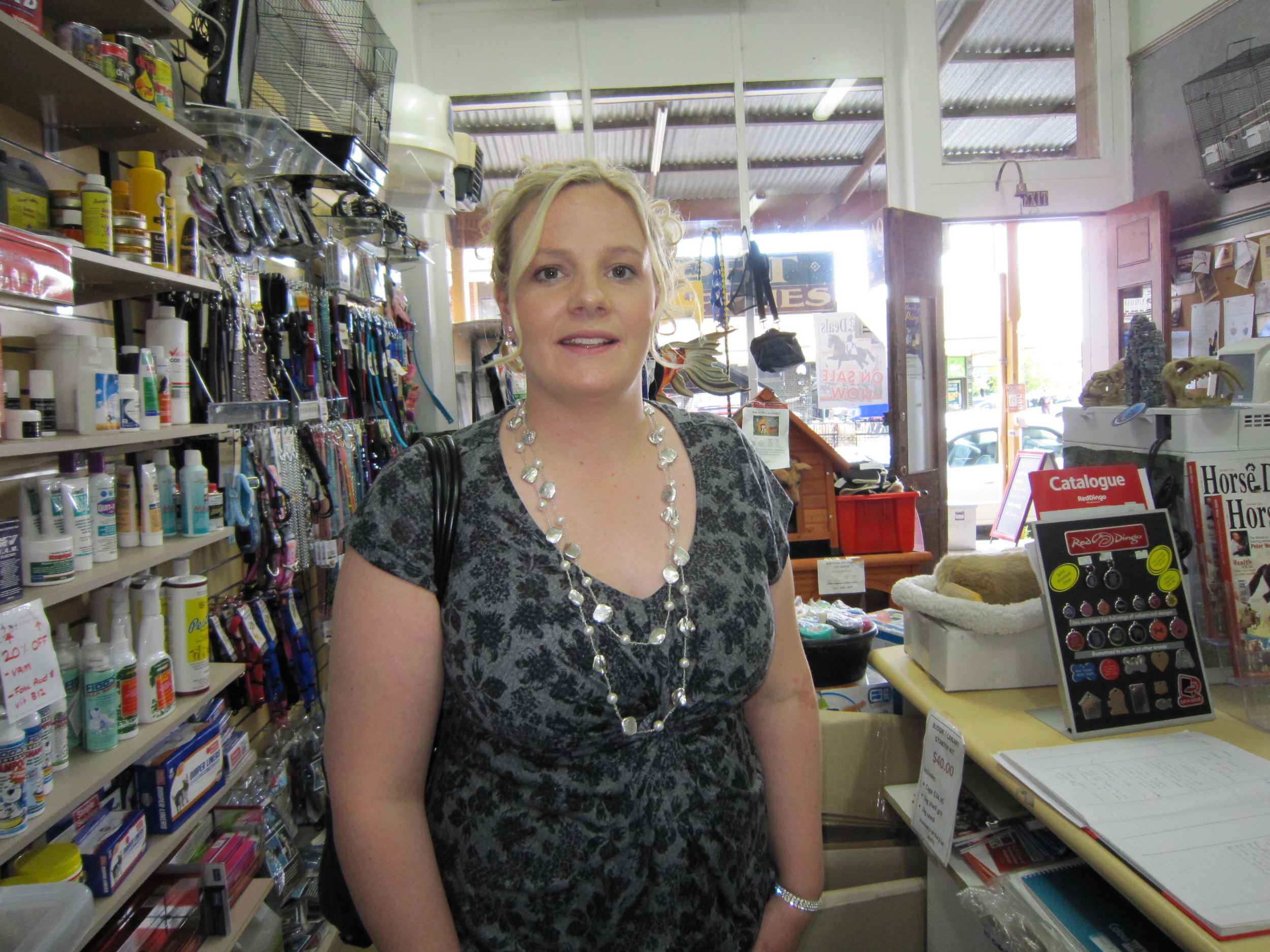 Not a normal day in the shop. Elise farewells staff as she prepares to meet the Queen at Government House in 2011.