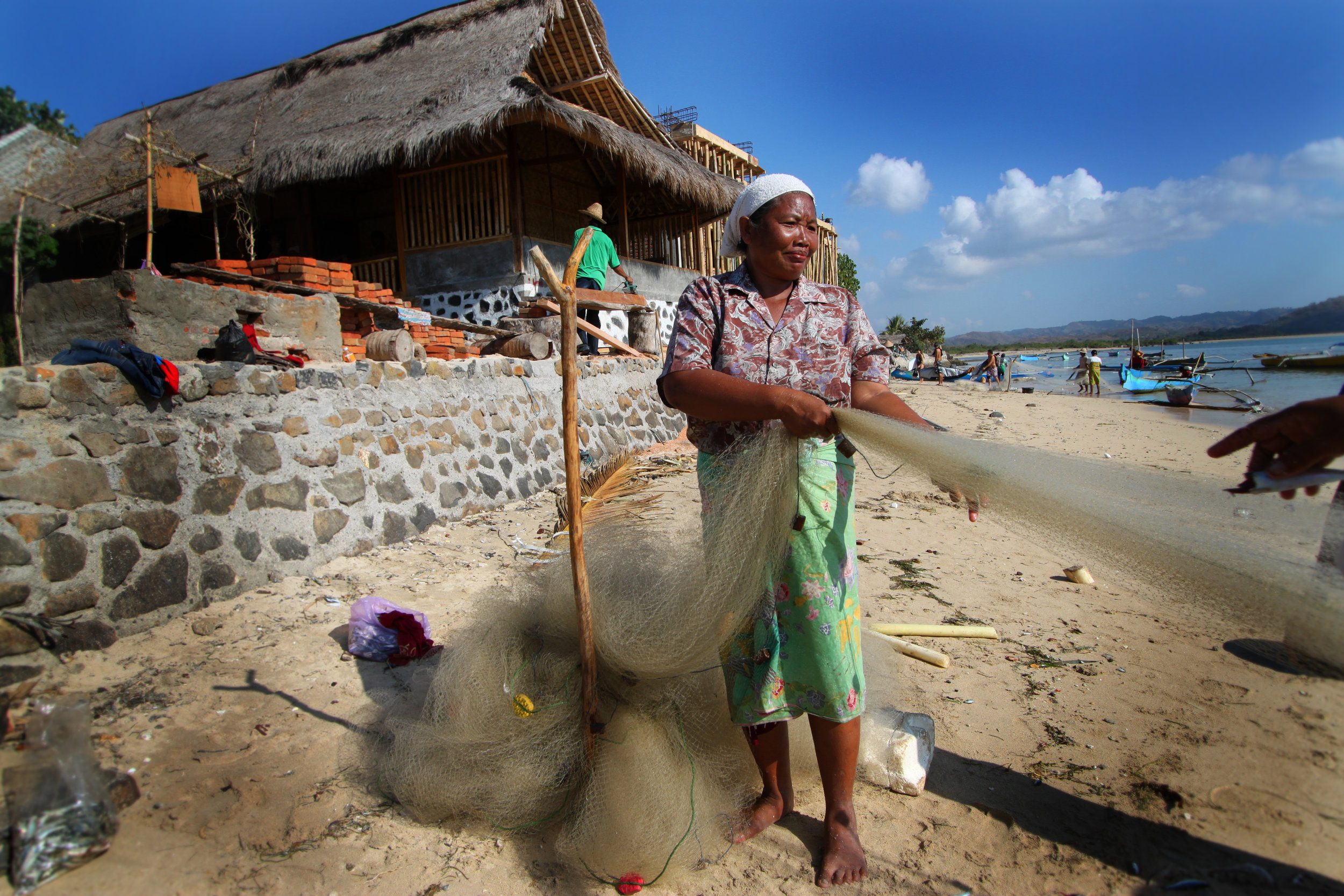 woman pulling net Indonesia.jpg