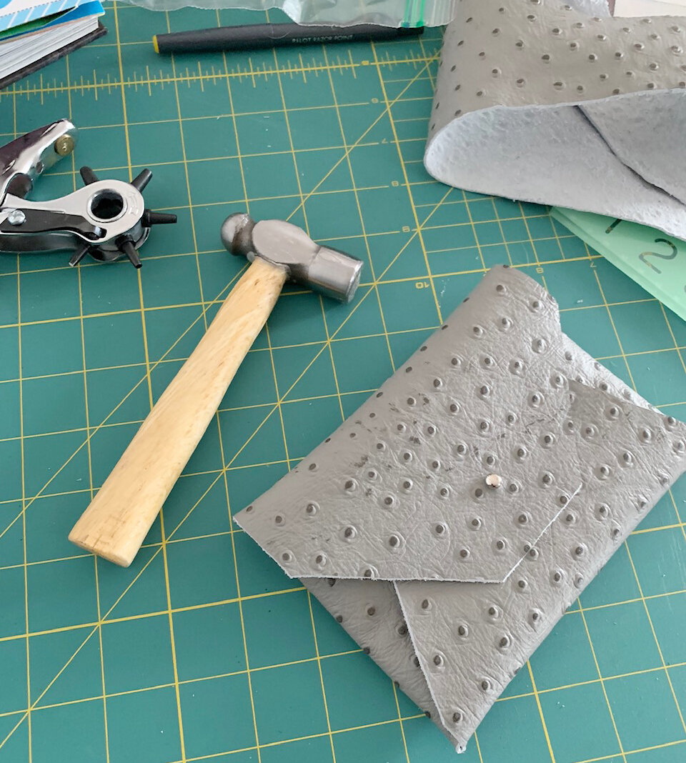 A handmade leather wallet in progress.