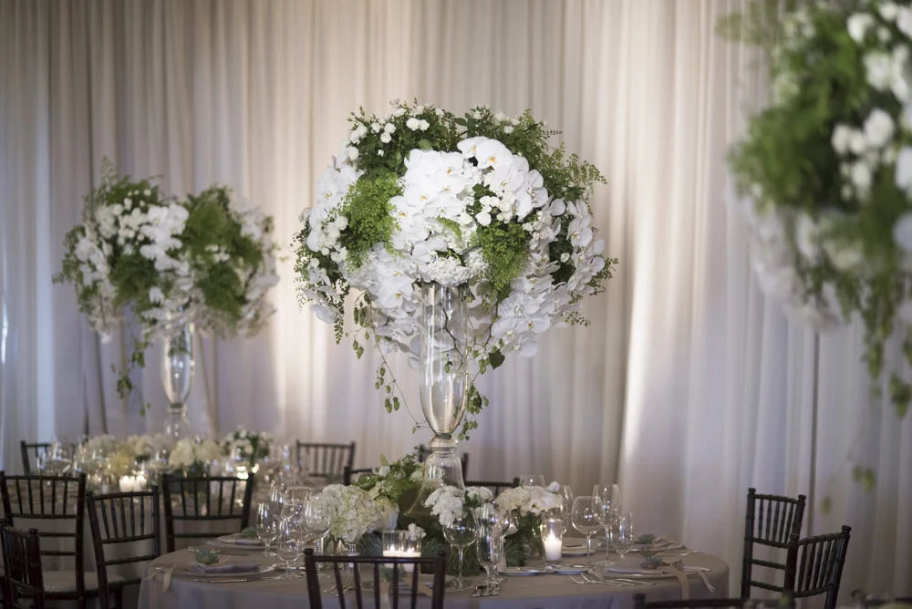Elegant wedding reception tabletop decor and orchid centerpieces at The Resort at Pelican Hill - designed by Eddie Zaratsian Lifestyle and Design, Photo by John and Joseph Photography