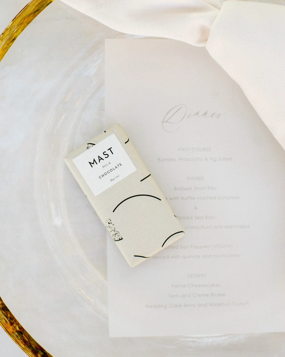 Wedding table setting with menu and Mast chocolate bar, floral design by Eddie Zaratsian - Wedding at Hummingbird Nest Ranch