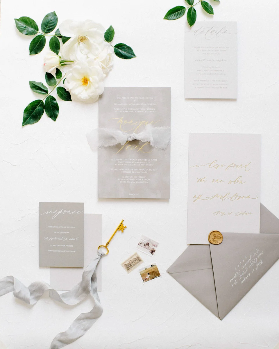 Grey and gold wedding invitations for a wedding at Hummingbird Nest Ranch