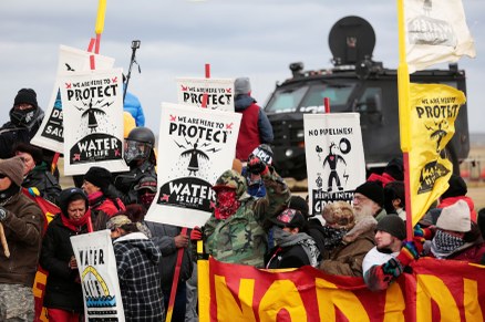 Dakota Access Pipeline protesters square off against police near the Standing Rock Reservation and the pipeline route outside the little town of Saint Anthony, North Dakota. Photo: Terray Sylvester/Reuters