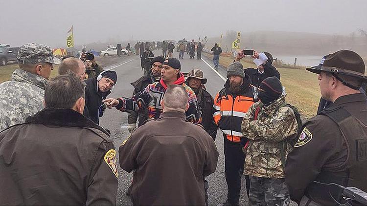 A handout photo from the Morton County Sheriff's Department shows protesters and law enforcement personnel during a demonstration against the North Dakota oil pipeline project Thursday. (Morton County Sheriff's Department / EPA) via LA Times