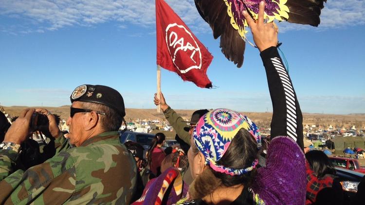 Demonstrators against the Dakota Access oil pipeline hold a ceremony at the main protest camp Nov. 15 near Cannon Ball, North Dakota. (James MacPherson / Associated Press)