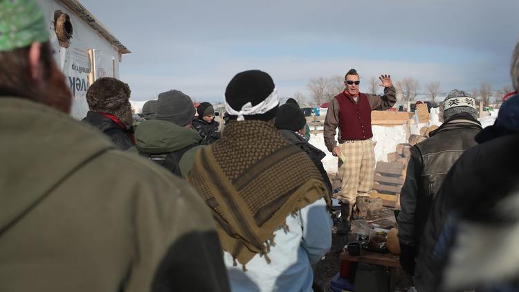 Military veterans are briefed on camps rules and their mission at Oceti Sakowin Camp on the edge of the Standing Rock Sioux Reservation on Saturday outside Cannon Ball, N.D. (Scott Olson / Getty Images via LA Times)