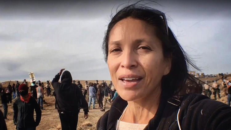 Journalist Jenni Monet reports from an Oct. 27 sweep during a mass demonstration over the Dakota Access pipeline in Morton County, North Dakota. (Photo courtesy of Jenni Monet)