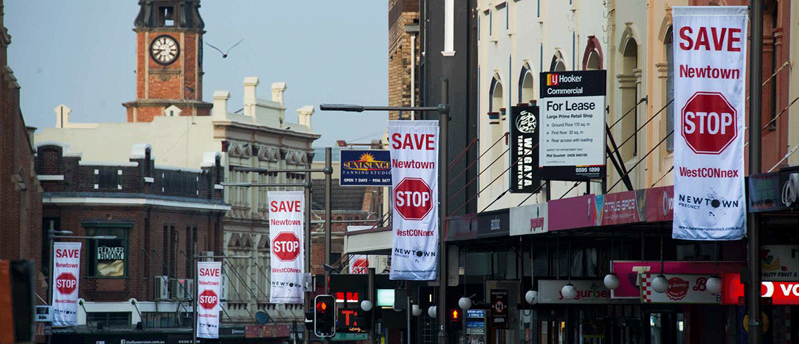 SCRIMWORKS_BANNER_MESH_SHADE_CLOTH_PRINTED_SIGNAGE_BANNER_GALLERY_POLY_FLAG_AND_STAGE_SAVE_NEWTOWN_STOP_WESTCONNEX.png