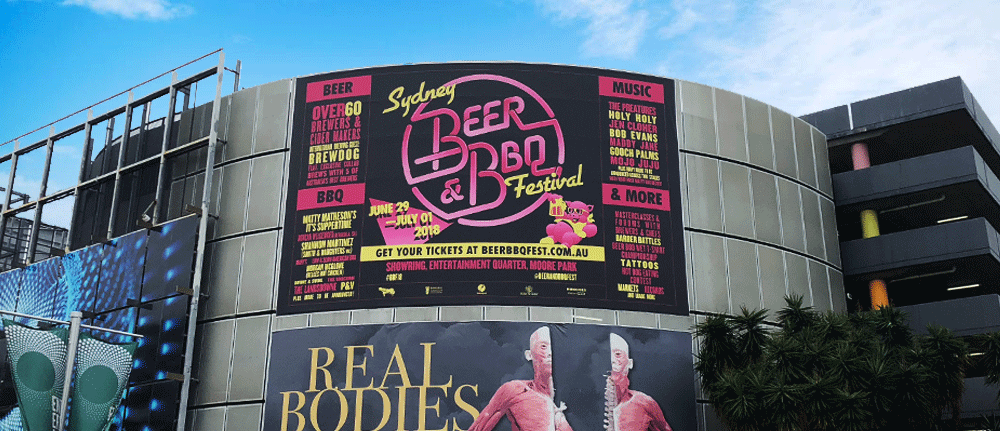 SCRIMWORKS_EXTERIOR_PREMIUM_BANNER_MESH_SHADE_CLOTH_PRINTED_CONSTRUCTION_EVENTS_SIGNAGE_FENCING_HOARDING_JUMP_FORM_BILLBOARD_CATTLEYARD_BEERBBQFEST_GROOVIN_THE_MOO_FESTIVAL_EQ_FOX_STUDIONS_MOORE_PARK.png