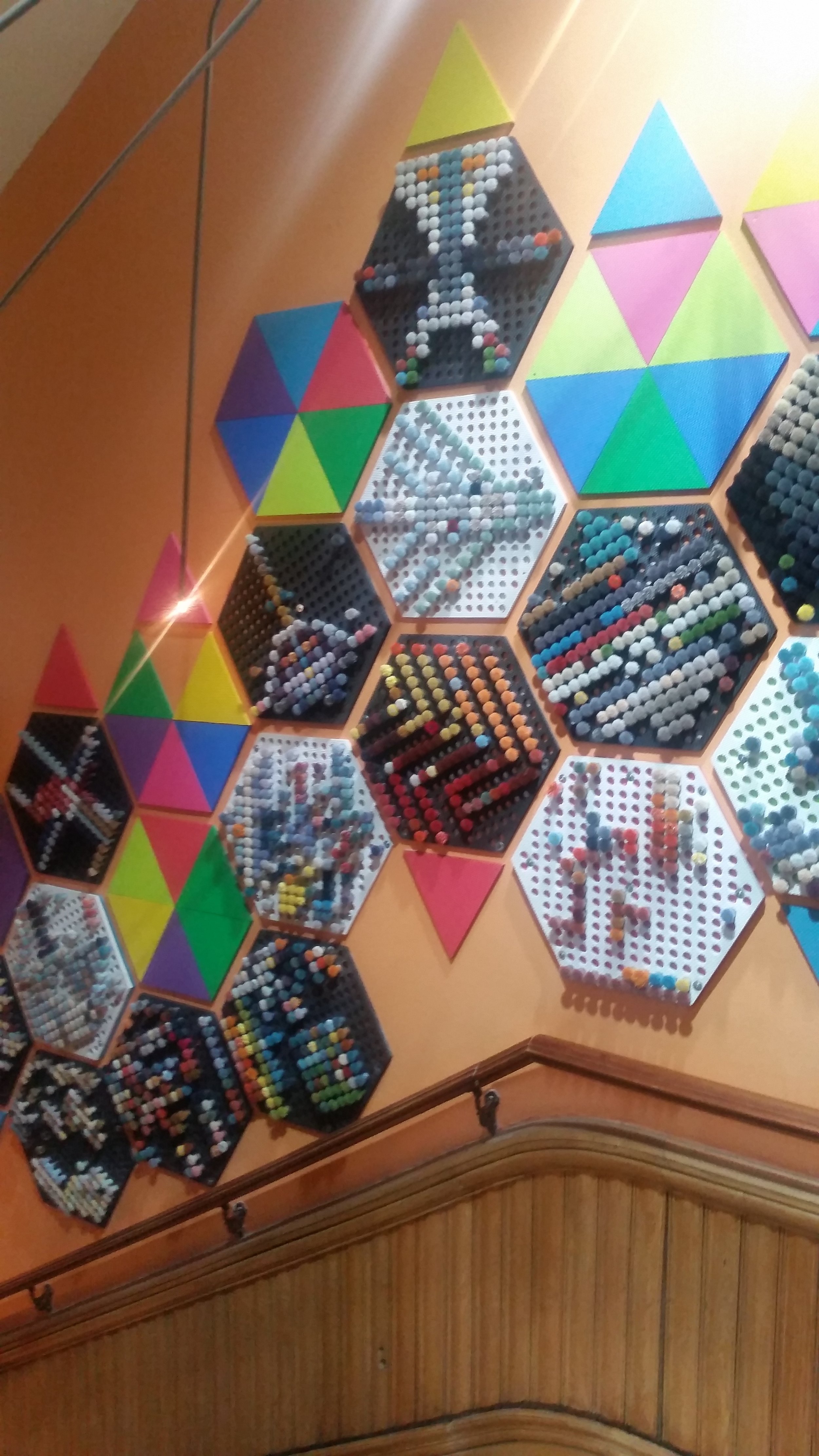 The interactive and ever changing Fibre Pixel Wall by Totem Design Co. Visitors were encouraged to move the "poms" around to create new patterns. Rug designers use these "poms" for colour selection.
