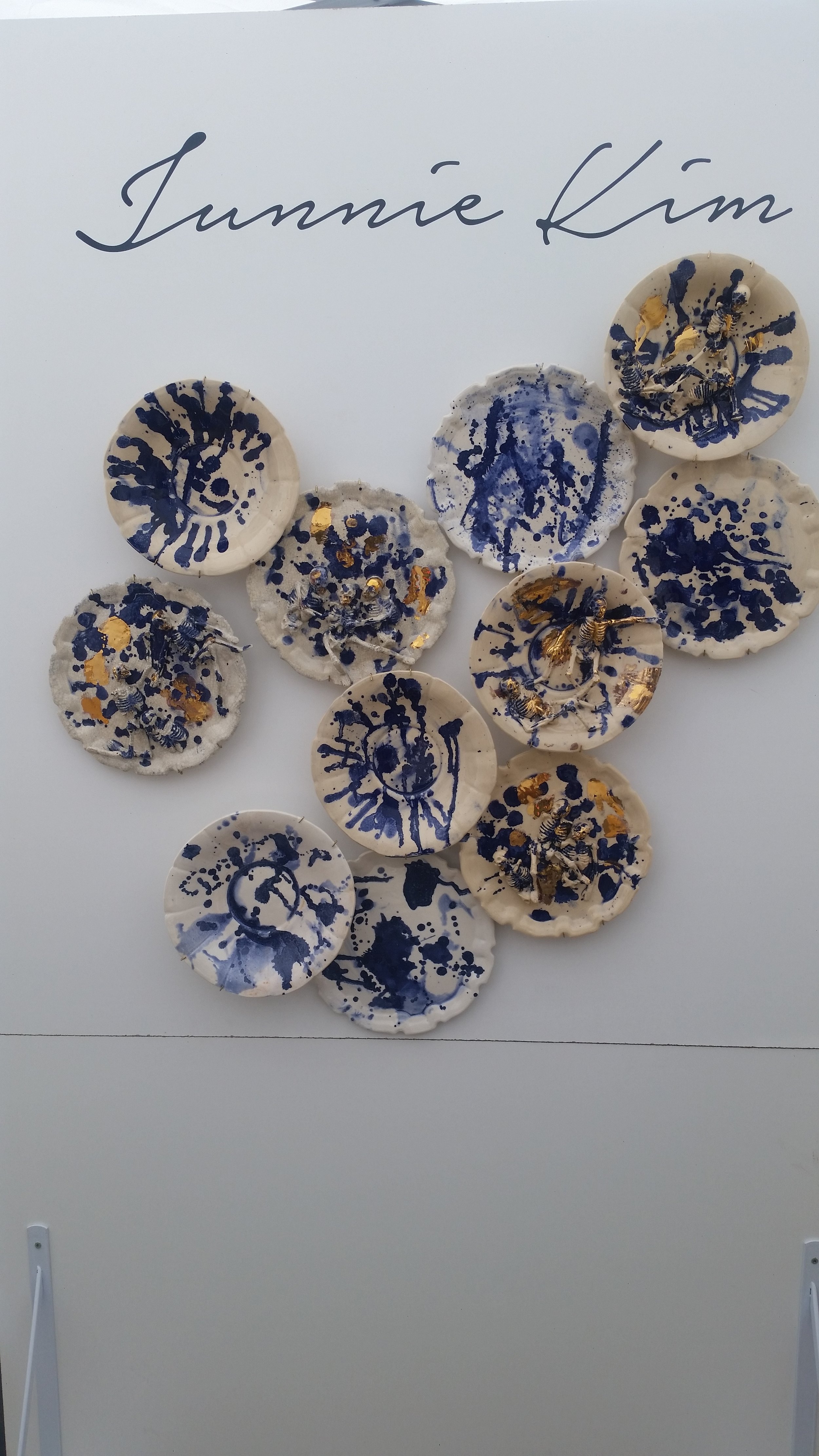 Junnie Kim. Her work was fantastic. First reaction when I walked in was "ooh, pretty", then I got closer...