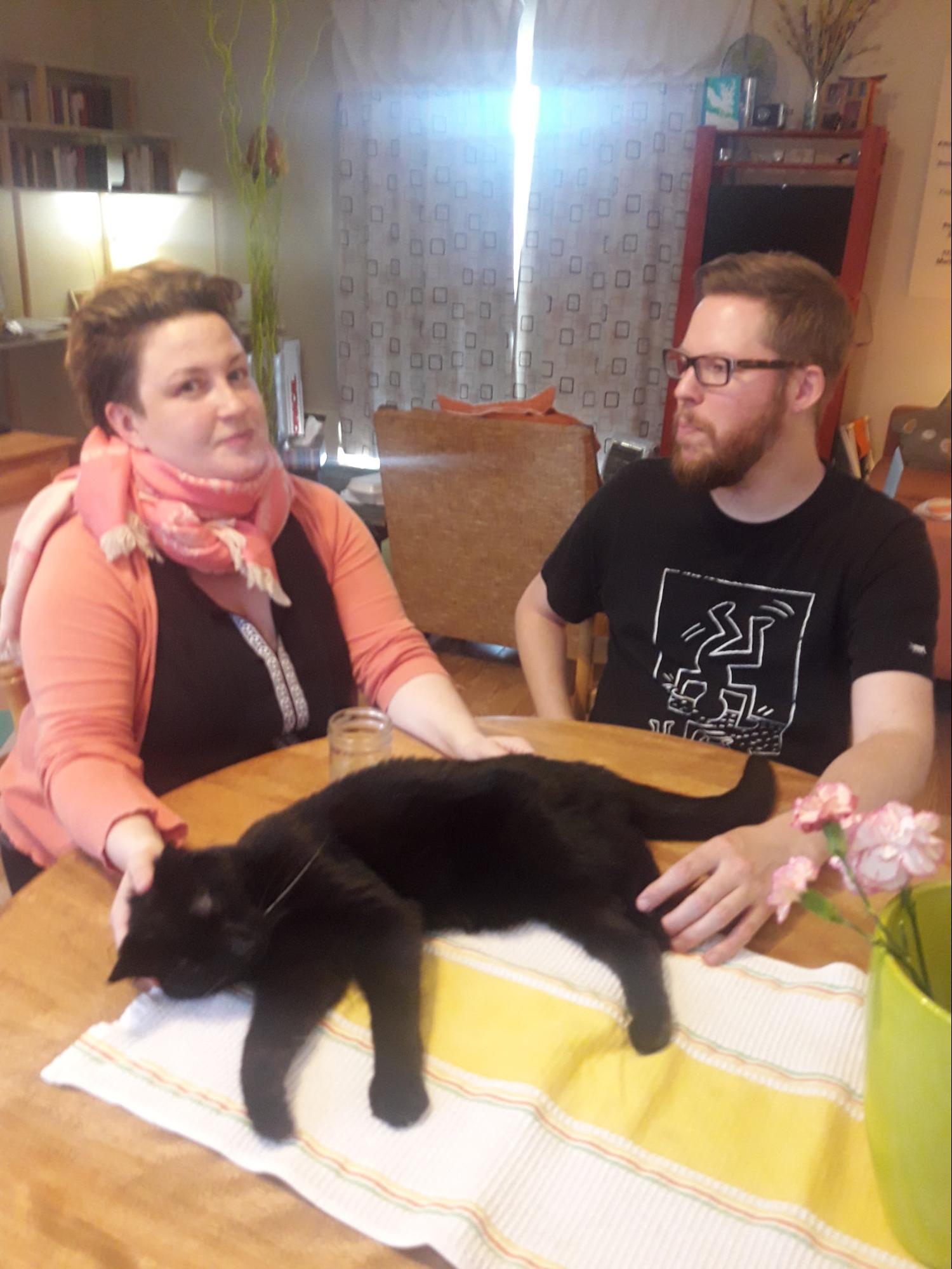Denise and Timothy with Damien at their kitchen table, 2018. Photo by Tess Martens