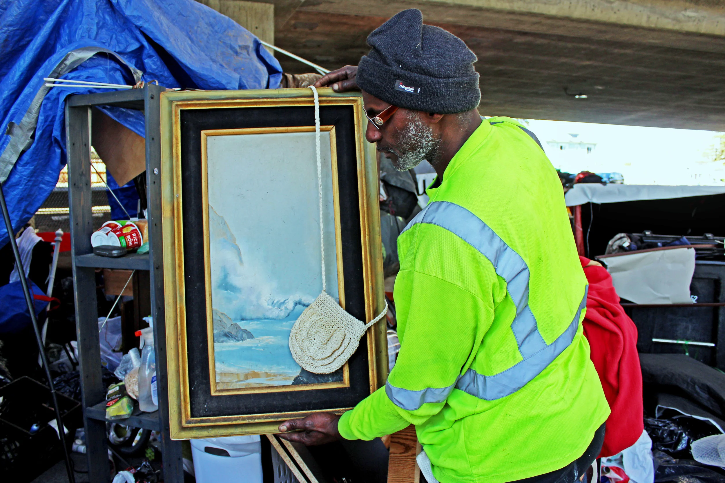 A Northgate resident collects found treasures like this framed painting of the ocean. Before becoming homeless he worked for BART where he was responsible for clearing out homeless encampments.