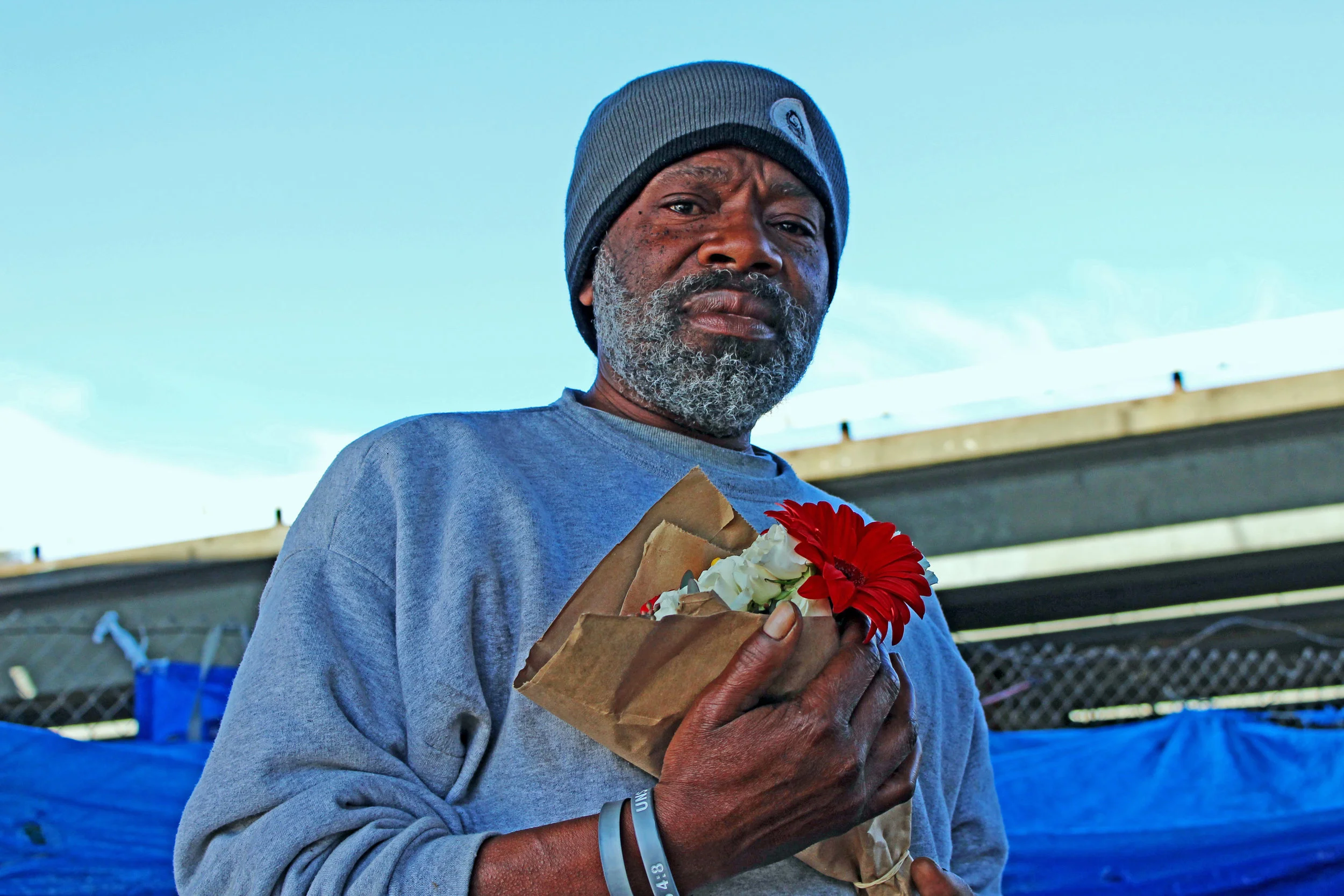 Chuck (pictured) is a Northgate resident. He says that he's chosen to live at here so that he can protect his nephew, who also lives at the encampment. "I don’t want to leave him, he’s right next to me," he says. "If I leave him these wolves will tear him up. They done burnt down his tent 2 times."