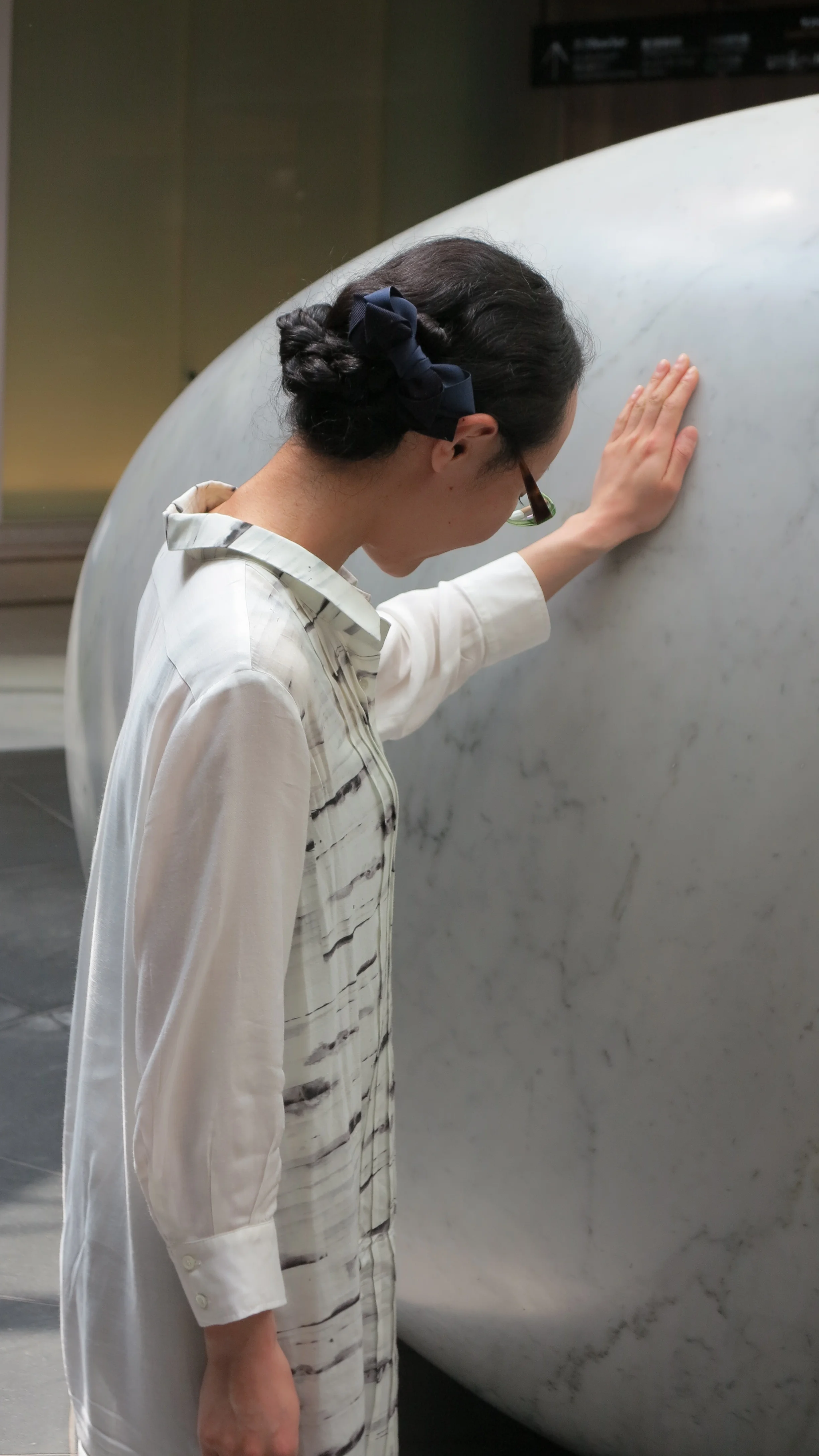 Mayako feeling the stone.JPG
