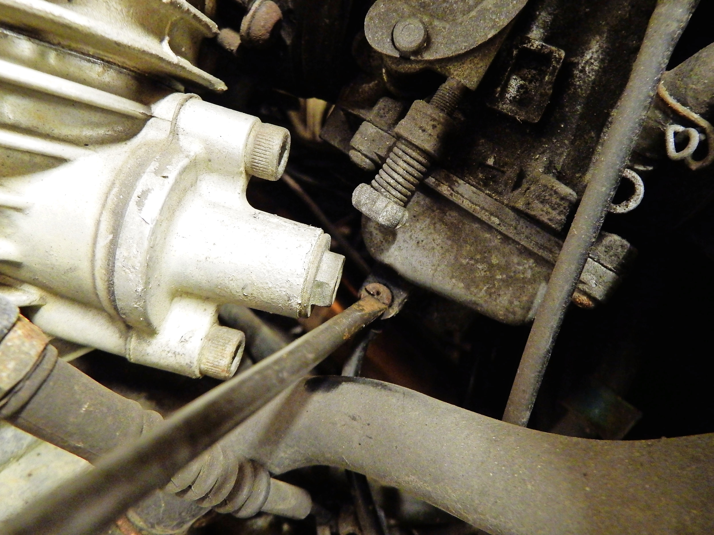 How can using axle clamps in the vice reduce the rattle on a Triumph front brake? read on...