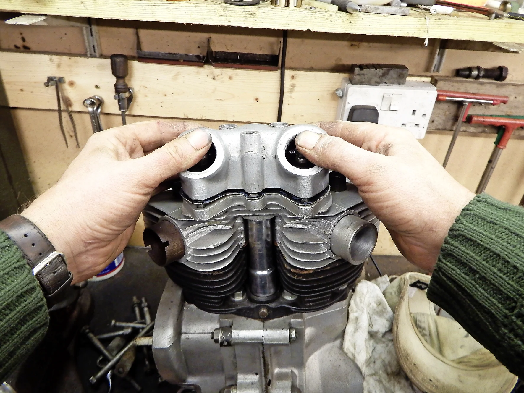 4. Supporting the rockers gently with your thumbs, lower the rocker box down vertically, feeling the pushrods engage as it settles down onto the gasket.