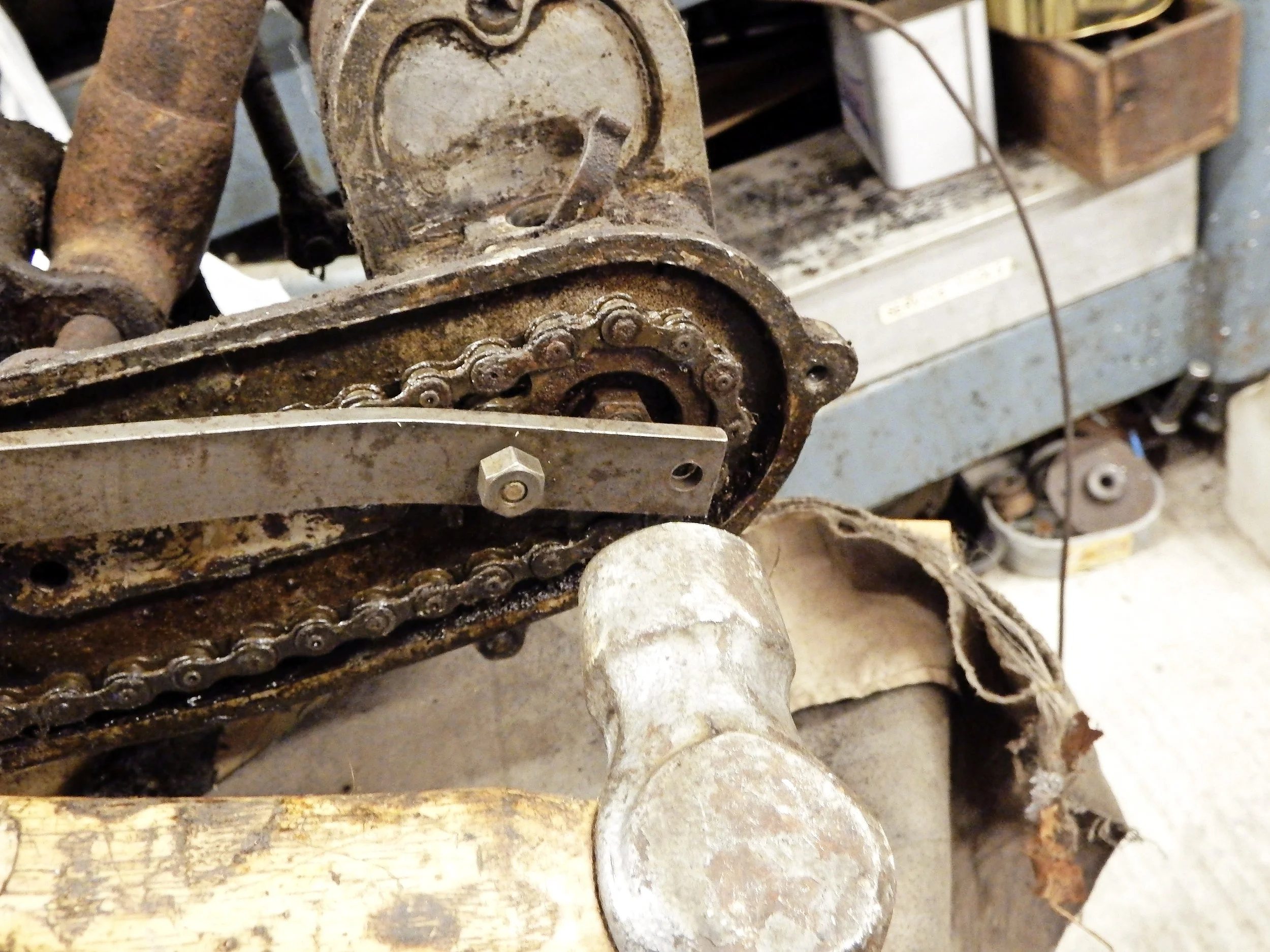 4. If the sprocket is really stuck, don’t use excess force on the lever; keep up the pressure and smartly strike the blade with a hammer where it crosses the pinion nut to spring it free.