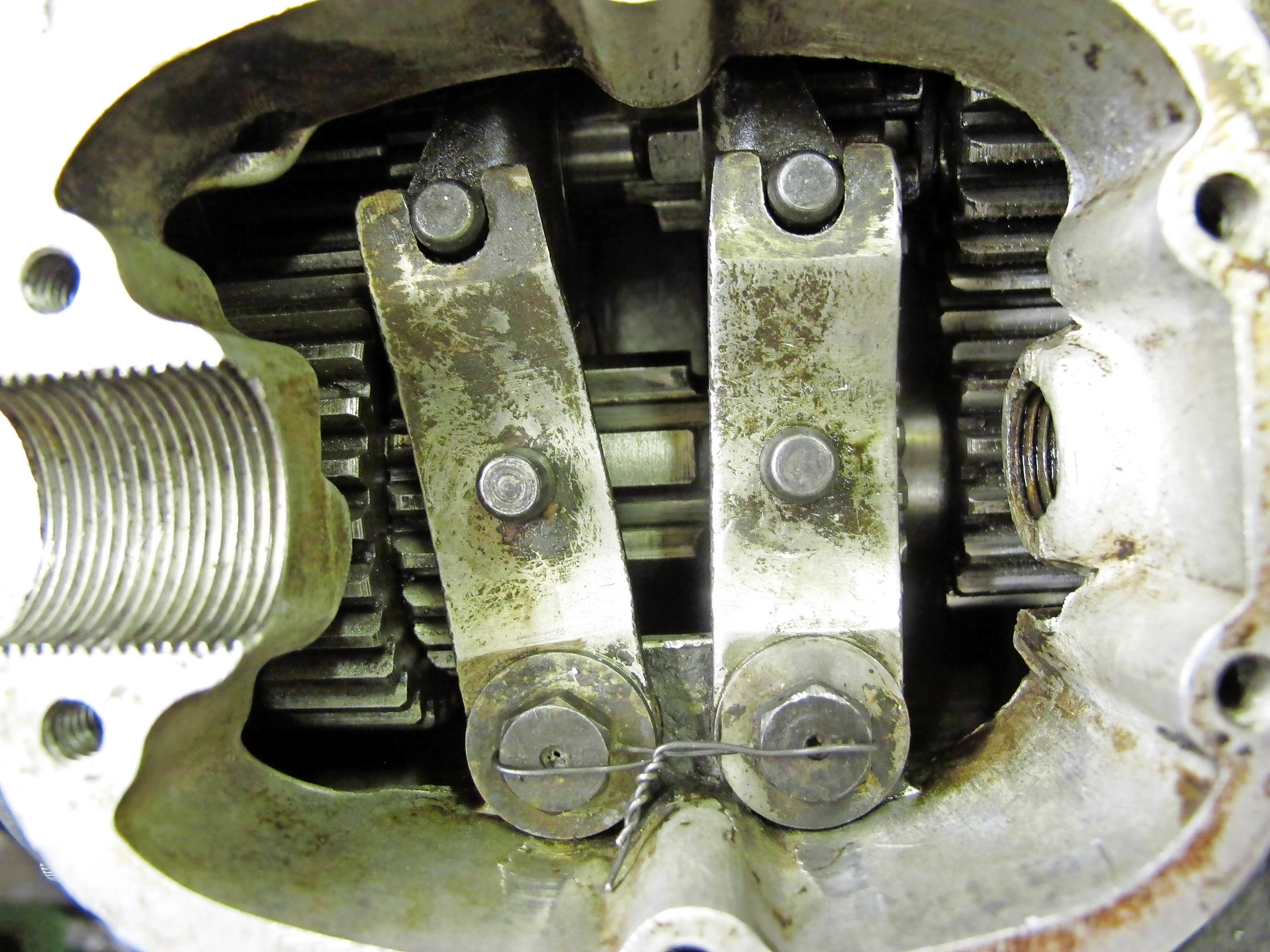 2. In first gear (camplate removed for view) all looks well. The two gears bottom left are snuggled together, while the two gears top right (fourth) are well separated.