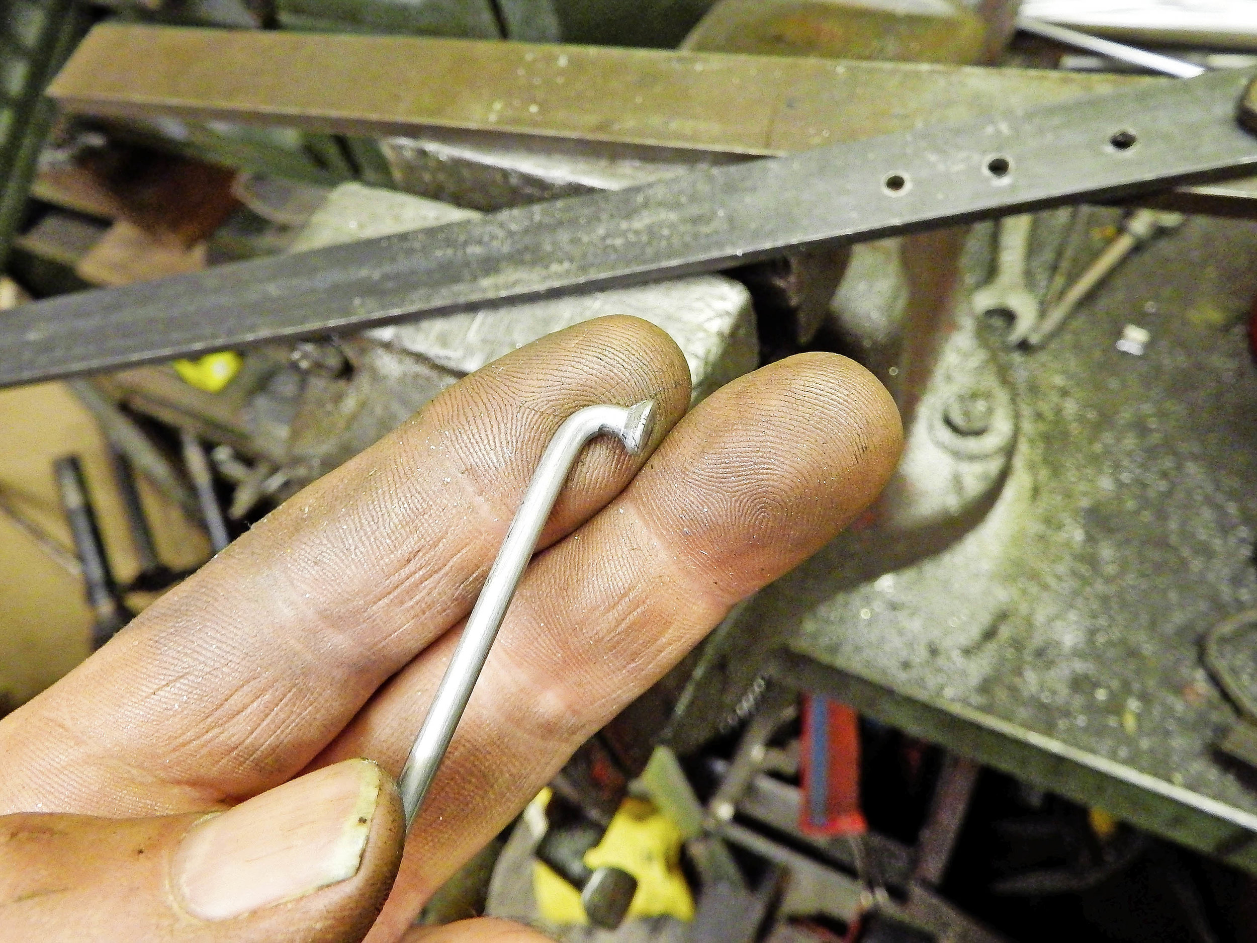 3. Bingo! The depth of the bend is set by the thickness of the metal strip – hence why my ‘scissors’ have two thicknesses of blade. Aluminium hubs have thicker spoke flanges and will probably need the deeper bend.
